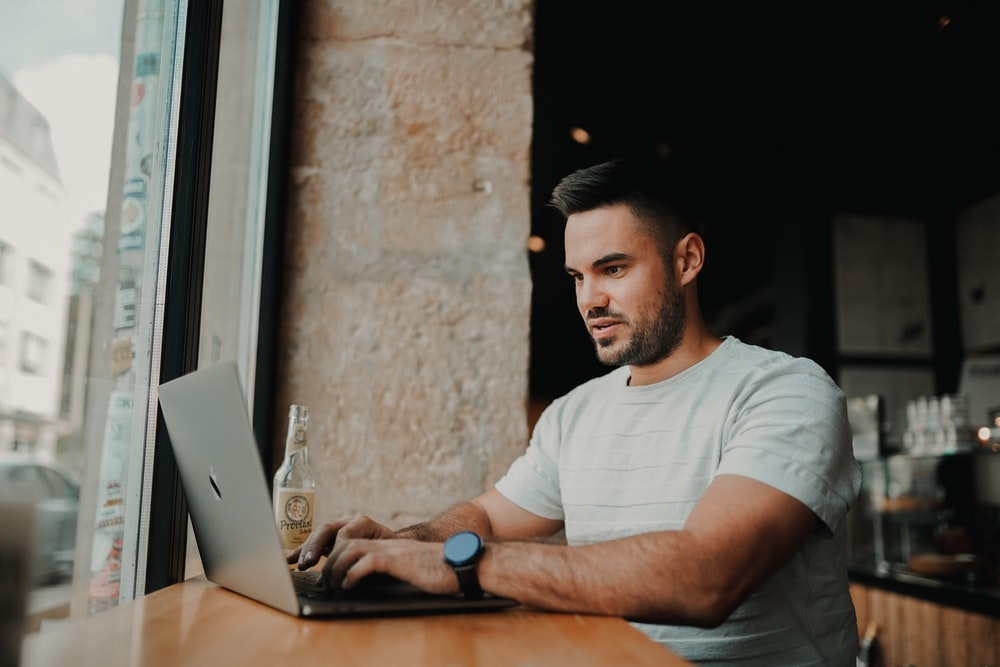 A candidate typing on a laptop